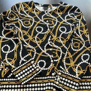 Cardigan with gold chains and pearls